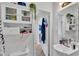 Cozy bathroom features built-in shelving and a white sink and vanity providing practical storage at 723 W Patterson St, Lakeland, FL 33803