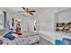 Cozy bedroom with carpet, ceiling fan, and adjacent walk-in closet providing lots of space at 723 W Patterson St, Lakeland, FL 33803