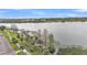Scenic view of a serene lake with a paved walkway and lush greenery at 723 W Patterson St, Lakeland, FL 33803