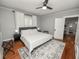 Bedroom with modern furniture, large windows, and hardwood floors with a rug at 805 Johnson Ave, Lakeland, FL 33801