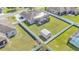 Aerial view of the property showcasing a spacious backyard, screened patio, and fenced yard at 8158 Woodvine Cir, Lakeland, FL 33810