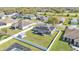 Aerial view of a home with a large fenced backyard, screened patio, and mature landscaping at 8158 Woodvine Cir, Lakeland, FL 33810