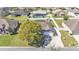 Aerial view of home featuring solar panels, fenced-in backyard and proximity to neighboring houses at 8158 Woodvine Cir, Lakeland, FL 33810