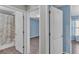 This bathroom has tile flooring, a bath tub with shower and is adjacent to a bedroom at 8158 Woodvine Cir, Lakeland, FL 33810