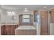 Bright bathroom featuring a soaking tub under a window and a glass-enclosed shower at 8158 Woodvine Cir, Lakeland, FL 33810