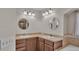 This bathroom features dual sinks, a bathtub, and tile flooring at 8158 Woodvine Cir, Lakeland, FL 33810