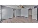 Light and airy bedroom offering laminate floors and neutral gray wall paint at 8158 Woodvine Cir, Lakeland, FL 33810