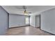 Light and airy bedroom offering laminate floors and neutral gray wall paint at 8158 Woodvine Cir, Lakeland, FL 33810