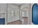 Inviting entryway with decorative glass doors and an arched opening into the living area at 8158 Woodvine Cir, Lakeland, FL 33810
