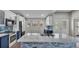 This kitchen features white quartz countertops, navy blue cabinets, and stainless steel appliances at 8158 Woodvine Cir, Lakeland, FL 33810