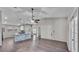 Open-concept living area featuring tile flooring and a kitchen island at 8158 Woodvine Cir, Lakeland, FL 33810