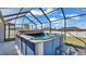 Hot tub inside a screened patio, providing a relaxing outdoor space at 8158 Woodvine Cir, Lakeland, FL 33810