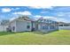 Relaxing screened patio with a hot tub and ample space for outdoor seating at 8158 Woodvine Cir, Lakeland, FL 33810
