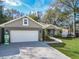 Charming single-story home with a well-maintained lawn, attached garage, and welcoming curb appeal at 8160 Se 164Th Pl, Summerfield, FL 34491