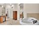 Bathroom featuring a bathtub, vanity and tiled floor at 9216 Tom Moore Rd, Lakeland, FL 33810