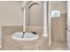 Bathroom featuring a white bathtub with columns, tile surround and a shower at 9216 Tom Moore Rd, Lakeland, FL 33810