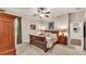 Bedroom featuring a neutral color palette, ceiling fan and wood furniture at 9216 Tom Moore Rd, Lakeland, FL 33810