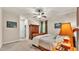 Bedroom featuring a neutral color palette, ceiling fan and wood furniture at 9216 Tom Moore Rd, Lakeland, FL 33810