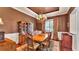 The dining room features hardwood floors, elegant furniture, and natural light at 9216 Tom Moore Rd, Lakeland, FL 33810