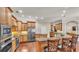 Gourmet kitchen with stainless steel appliances, granite countertops, and custom cabinetry at 9216 Tom Moore Rd, Lakeland, FL 33810