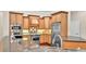 Well-equipped kitchen with stainless steel appliances, granite countertops, and ample cabinet space at 9216 Tom Moore Rd, Lakeland, FL 33810