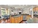 Spacious open-concept kitchen with granite countertops, stainless steel appliances, and breakfast bar at 9216 Tom Moore Rd, Lakeland, FL 33810
