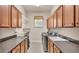 Functional laundry room equipped with washer, dryer, sink, and abundant cabinet storage at 9216 Tom Moore Rd, Lakeland, FL 33810
