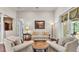 Cozy living room with neutral tones, comfortable seating, and abundant natural light at 9216 Tom Moore Rd, Lakeland, FL 33810
