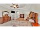 A well-lit main bedroom with neutral tones and beautiful furniture at 9216 Tom Moore Rd, Lakeland, FL 33810