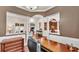 Office area features a large desk and chair with a view of the living room and dining room at 9216 Tom Moore Rd, Lakeland, FL 33810