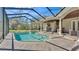 Large pool with spa and a full outdoor kitchen for ultimate relaxation and entertainment at 9216 Tom Moore Rd, Lakeland, FL 33810