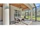 Screened porch offers outdoor dining and a relaxing view of the backyard at 9216 Tom Moore Rd, Lakeland, FL 33810