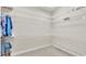 Walk-in closet featuring wire shelving and neutral carpet at 9216 Tom Moore Rd, Lakeland, FL 33810