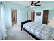 This bedroom features multiple windows, a ceiling fan, and closet space at 1007 Elizabeth Ln, Lakeland, FL 33809