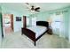 This airy bedroom is bathed in light and features a ceiling fan for climate control at 1007 Elizabeth Ln, Lakeland, FL 33809