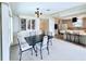 Bright dining room featuring modern light fixture and a large decorative cabinet at 1007 Elizabeth Ln, Lakeland, FL 33809