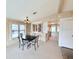 Dining area with a dark wood table, light walls, and a decorative hutch at 1007 Elizabeth Ln, Lakeland, FL 33809