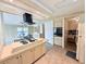 Open kitchen concept with island cooktop and seating, adjacent to the dining area at 1007 Elizabeth Ln, Lakeland, FL 33809