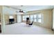 Inviting living room with lots of natural light, carpet, ceiling fan and an open layout at 1007 Elizabeth Ln, Lakeland, FL 33809