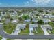 Expansive aerial view showing home's location in a serene neighborhood near community amenities at 1064 Penguin Pl, Lakeland, FL 33809