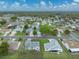 Beautiful aerial view shows tree covered neighborhood in a friendly community with lush, green landscaping at 1064 Penguin Pl, Lakeland, FL 33809