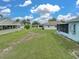 The backyard offers lots of green space between homes at 1064 Penguin Pl, Lakeland, FL 33809