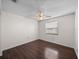 This bedroom offers wood floors, a ceiling fan, and natural light from the window at 1064 Penguin Pl, Lakeland, FL 33809