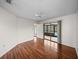 Bright bedroom featuring hardwood floors and sliding glass doors to outdoor patio at 1064 Penguin Pl, Lakeland, FL 33809