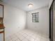 Bright dining area featuring tile floors, a large window, and a sliding glass door at 1064 Penguin Pl, Lakeland, FL 33809