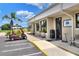 This exterior view displays the Links Grill entrance and golf cart parking at the golf course community at 1064 Penguin Pl, Lakeland, FL 33809