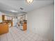 Bright kitchen with white appliances, tile floors, and ample counter space at 1064 Penguin Pl, Lakeland, FL 33809