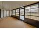 Enclosed sunroom featuring wall to wall windows and door to enjoy the natural light at 1064 Penguin Pl, Lakeland, FL 33809