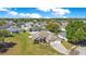 An aerial view showcases the property and its location within a residential neighborhood at 107 Amber Blvd, Auburndale, FL 33823