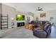 Spacious living room featuring tile floors, a ceiling fan, and ample natural light at 107 Amber Blvd, Auburndale, FL 33823